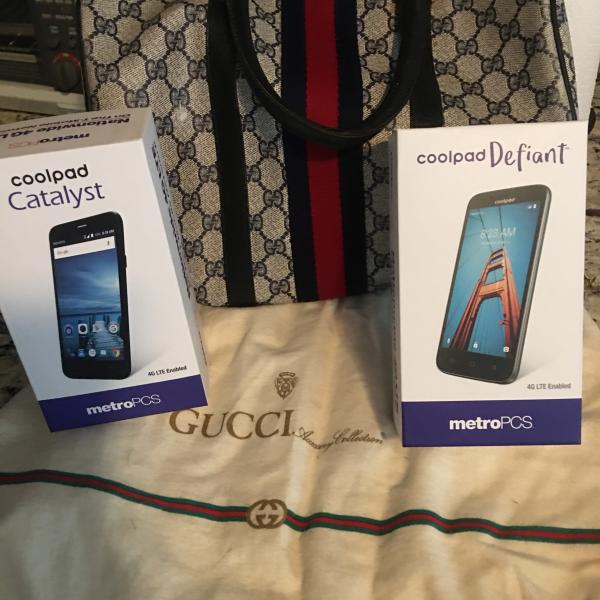 Photo of Gucci handbag and two metro cellphones with accessories 