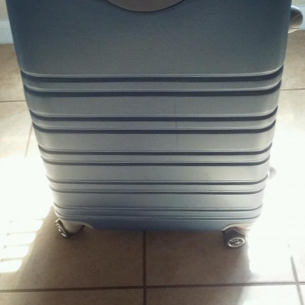 Photo of BLUE HARD COVER SUITCASE