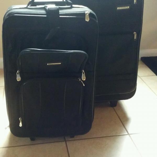Photo of TWO BLACK  SUITCASES