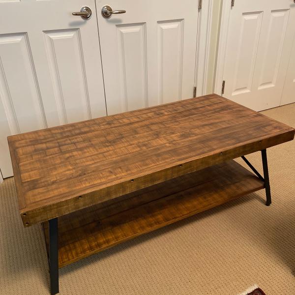 Photo of Wooden coffee table with metal legs