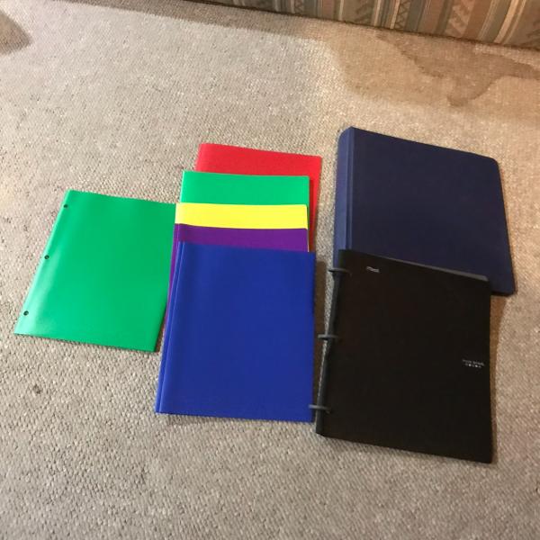 Photo of Two notebooks and plastic file holders 