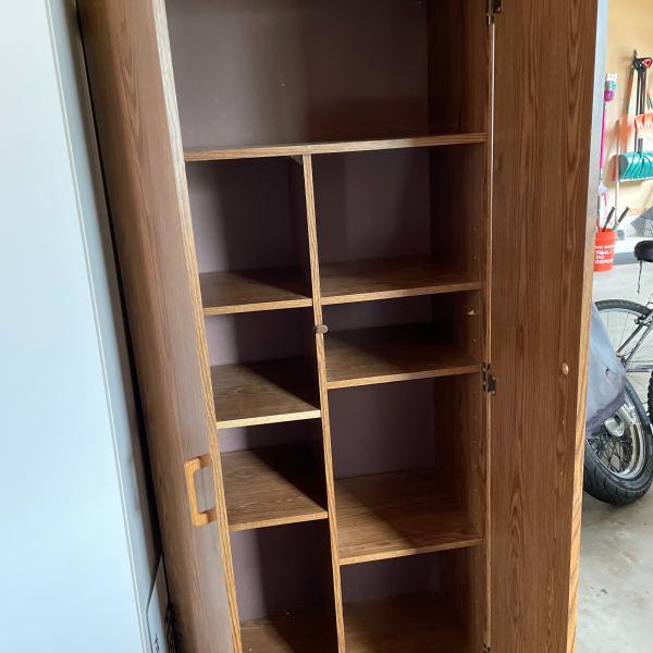Photo of Brown wooden cabinet 