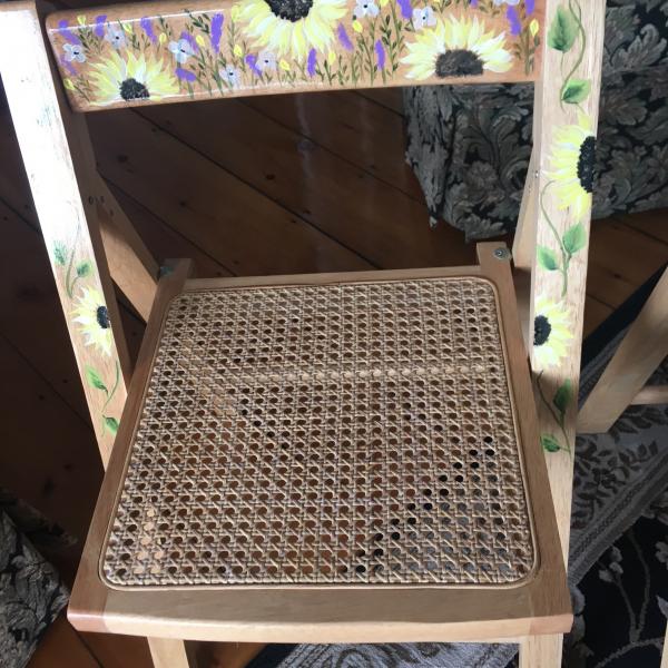 Photo of Hand painter folding wooden  chairs