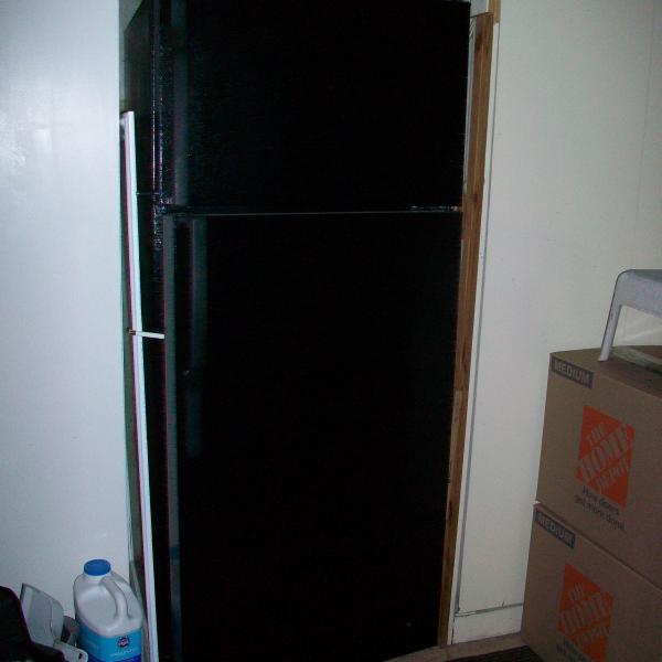 Photo of Black refrigerator, clean