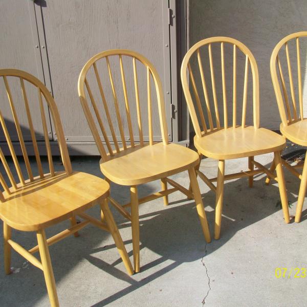 Photo of Four blond wood chairs