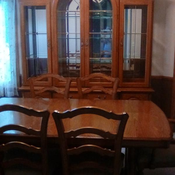 Photo of Oak dining room table and hutch