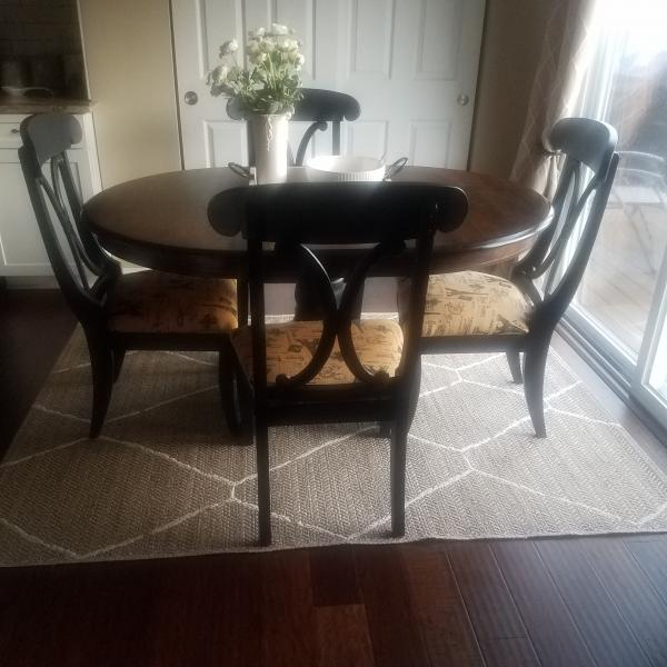 Photo of Dining room table with 4 chairs and leaf