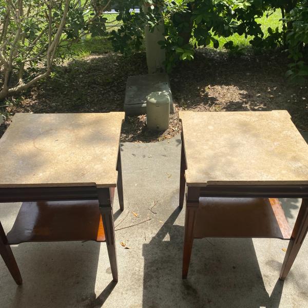 Photo of Two Marble/with a brown bottom  end tables