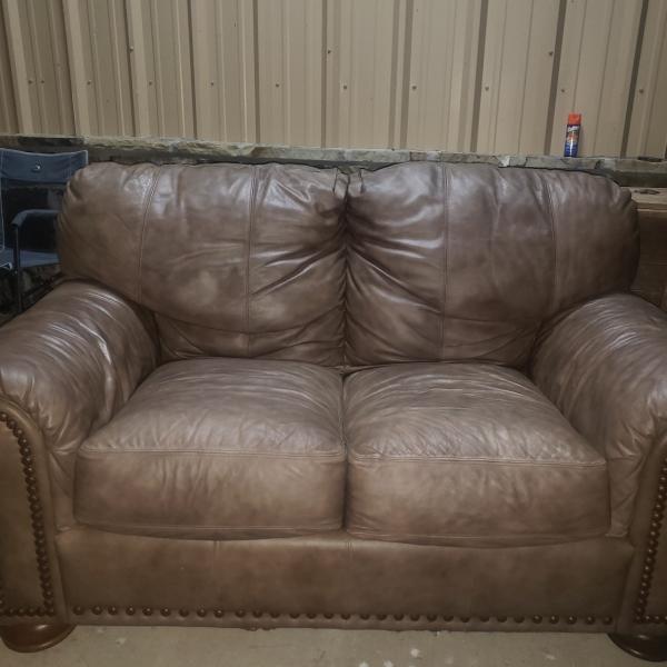 Photo of Light Brown Loveseat. In okay condition 
