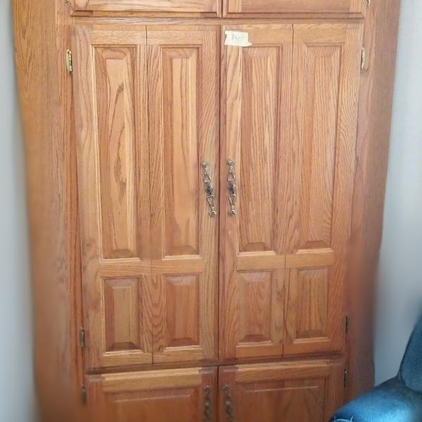 Photo of Solid oak corner cabinet
