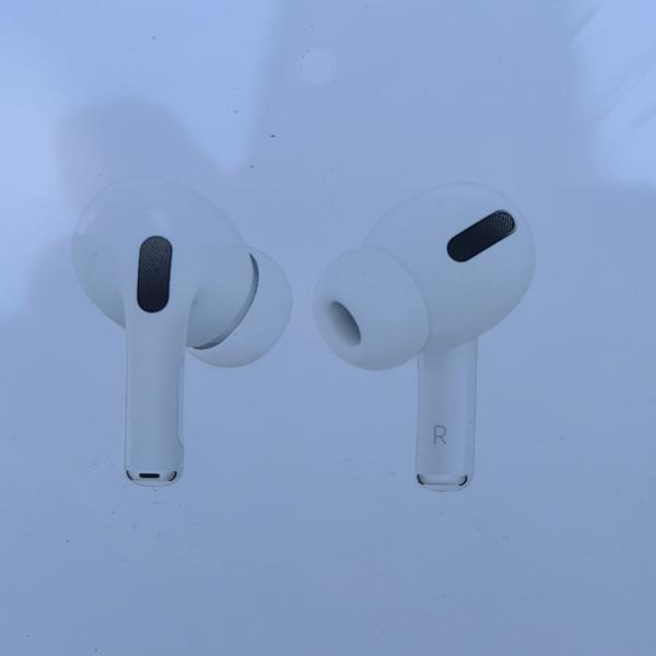 Photo of AirPod pro with wireless charging case.