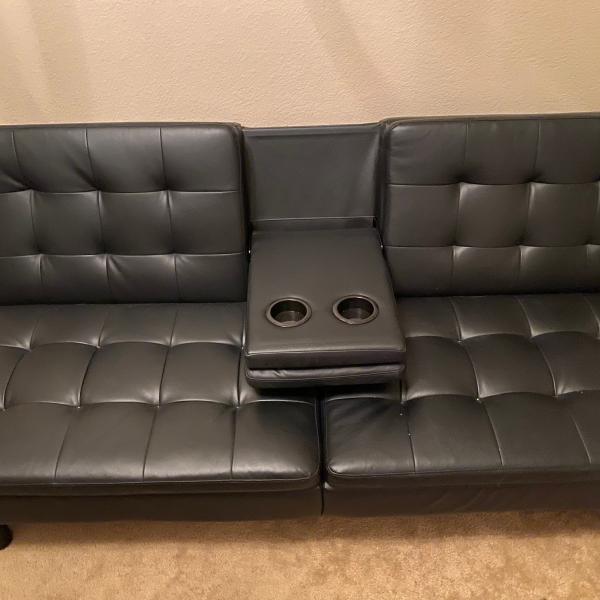 Photo of Like new black leather futon