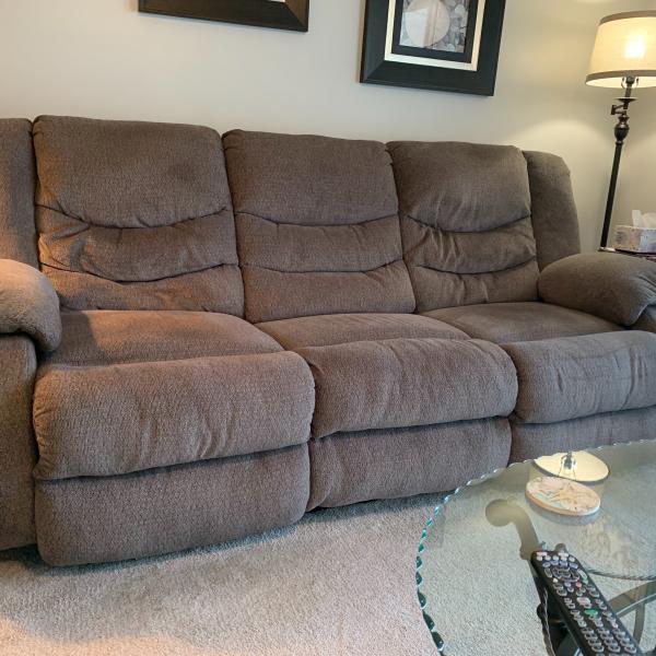 Photo of Grey recliner couch