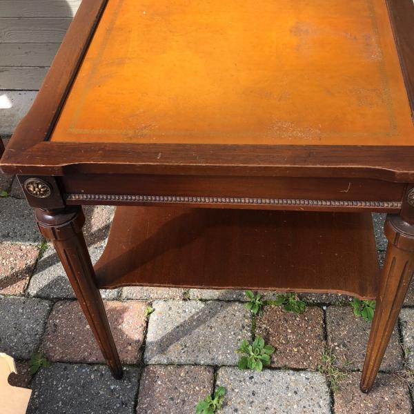 Photo of Antique side tables with leather tops 