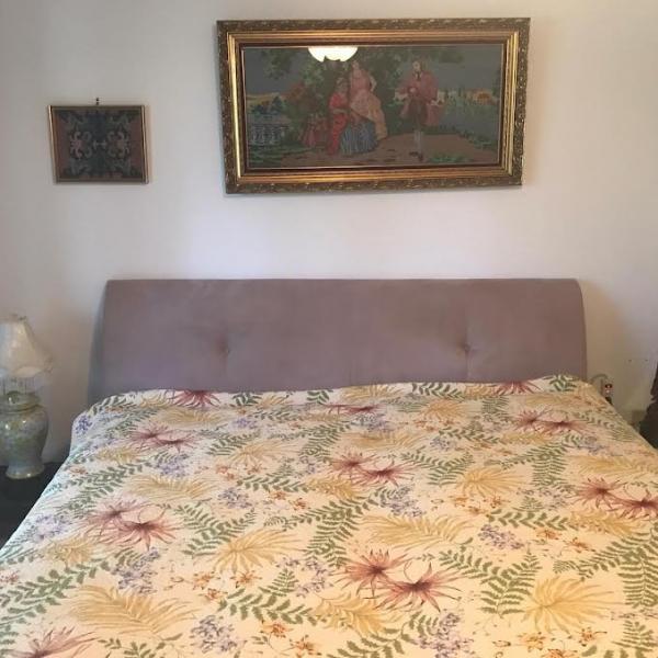 Photo of King size headboard with wood frame