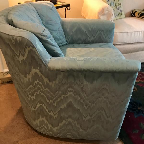 Photo of Upholstered Swiveling and Rocking Armchair