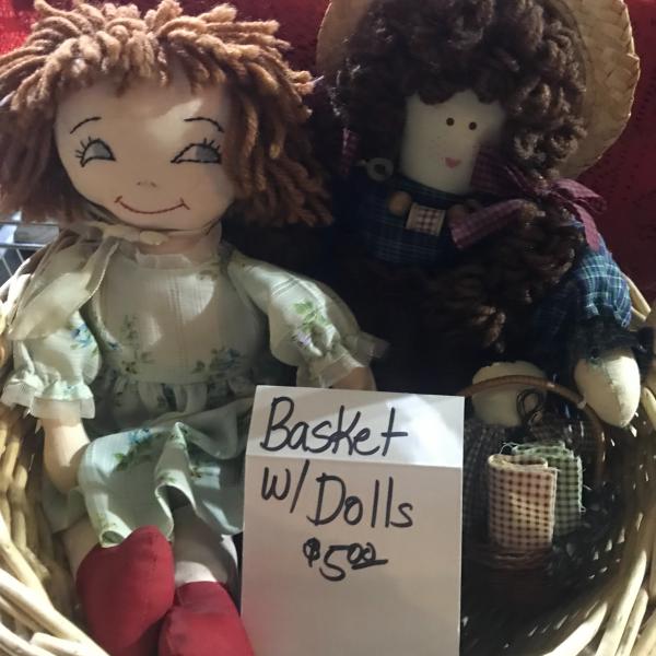 Photo of 2 dolls in a basket