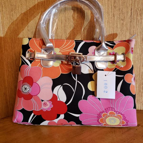 Photo of Vibrant Pink, Orange, Red, Yellow, Black and Silver Floral Material Purse