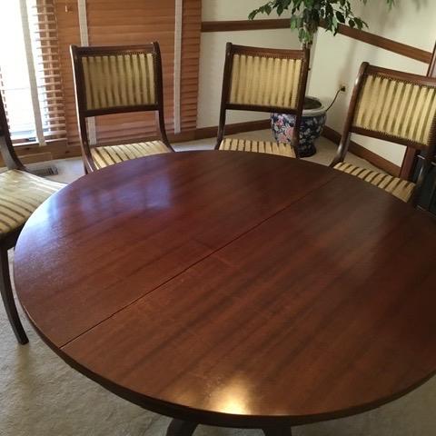 Photo of Dining room table  + chairs
