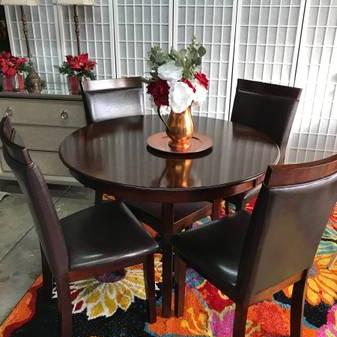 Photo of Beautiful dark Table and Chairs