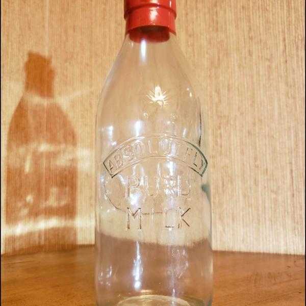 Photo of Beautiful Vintage "Absolutely Pure Milk"  Glass Bottle with Cork.