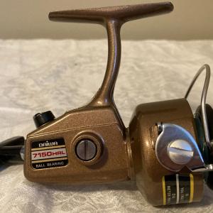 Photo of Daiva Spinning reel 7150 HRL with box and misc. papers