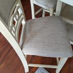 Cream counter height tabel and four chairs