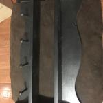 Black wooden shelves with post to hang clothing or tools etc