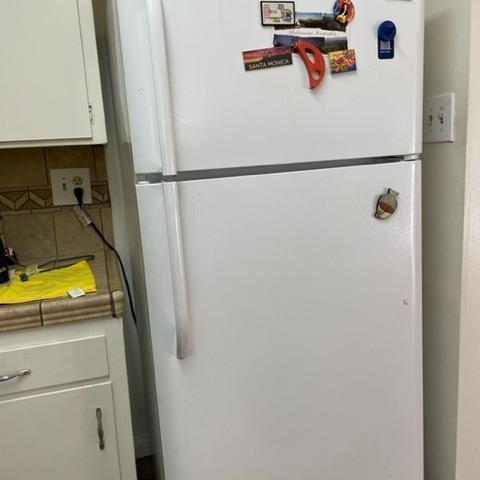 Photo of Frigidaire refrigerator and couch
