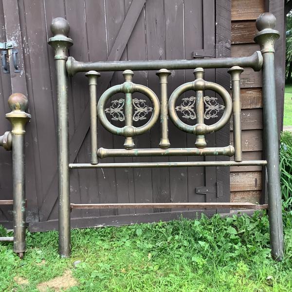 Photo of antique,vintage, old , unusual, rare, ornate brass bed.