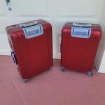     RED METALIC SUIT CASES (PRICE INCLUDES BOTH)