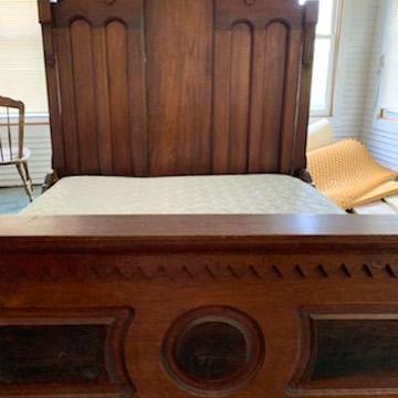 Photo of Full-sized antique bed.