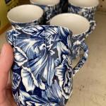 7 blue and white coffee mugs
