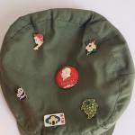 Vintage green hat or cap with pins