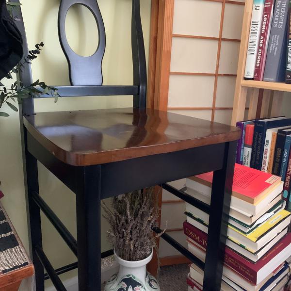 Photo of Tall wooden barstool or counter seat