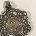 1935 S Silver Dime in a pendant holder