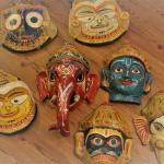 COLLECTION OF SEVEN COLORFUL VINTAGE PAPER MACHIE MASKS FROM INDIA