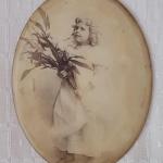 Lot 246: Antique 1894 Girl with Lilacs Photo in Glass by The Tabor Co.