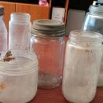 A couple of Mason jars and other antique bottles