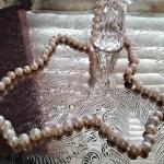 24" 7.5 mm Akoya Pearl necklace with an 18k clasp.