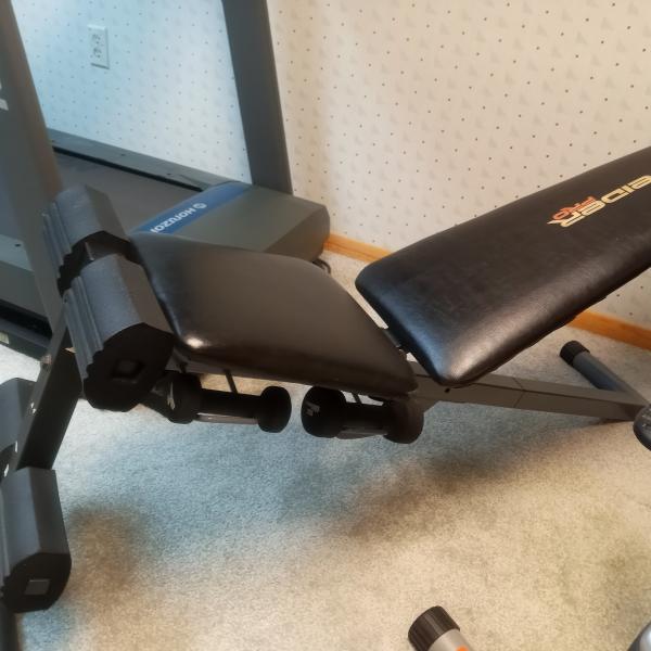 Photo of Sturdy Weight bench with weights included