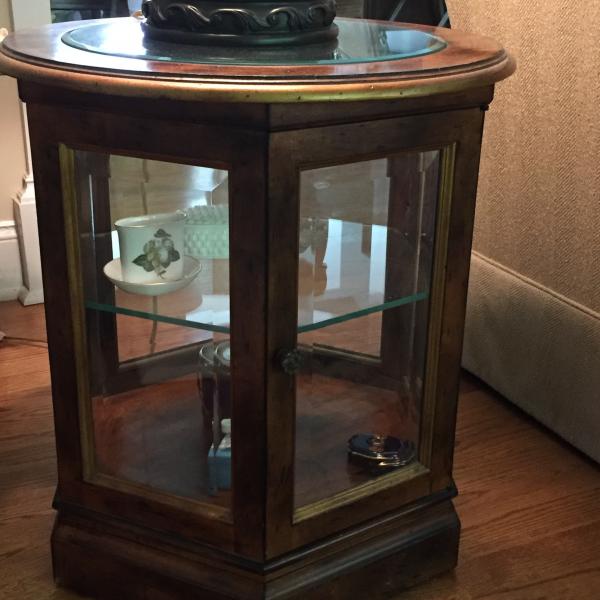 Photo of Glass and solid wood end table