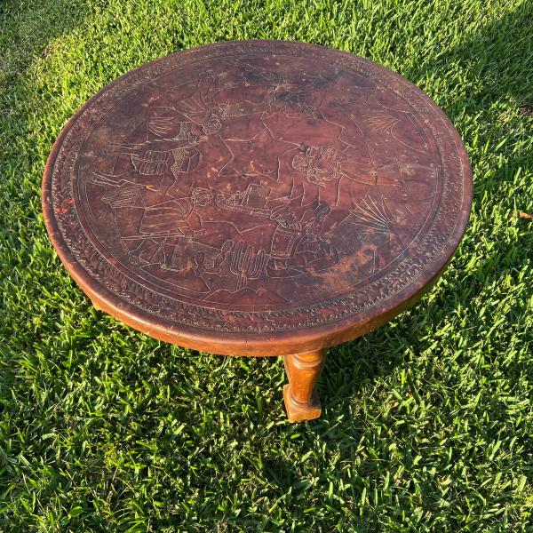 Photo of Hand carved leather top teak coffee table