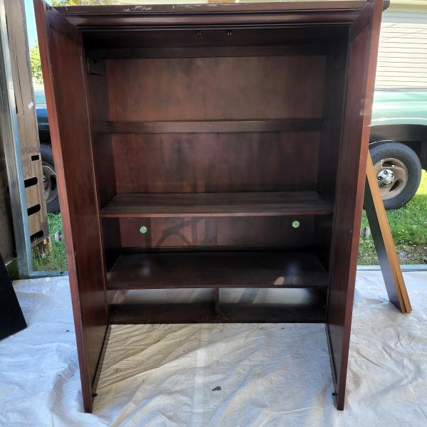 Photo of Wooden Cabinet with shelves