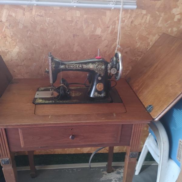 Photo of Antique sewing machine and Ford Rims