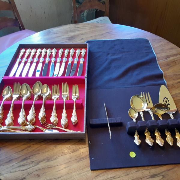 Photo of Gold plated silverware with serving pieces