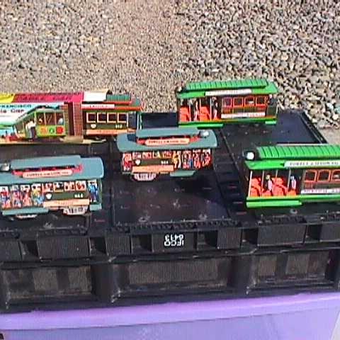 Photo of 50 old Japanese tinplate locos and trolleys. 