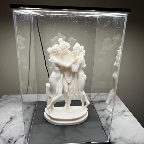 Photo of 3 Graces Goddesses of charm with display case with white light
