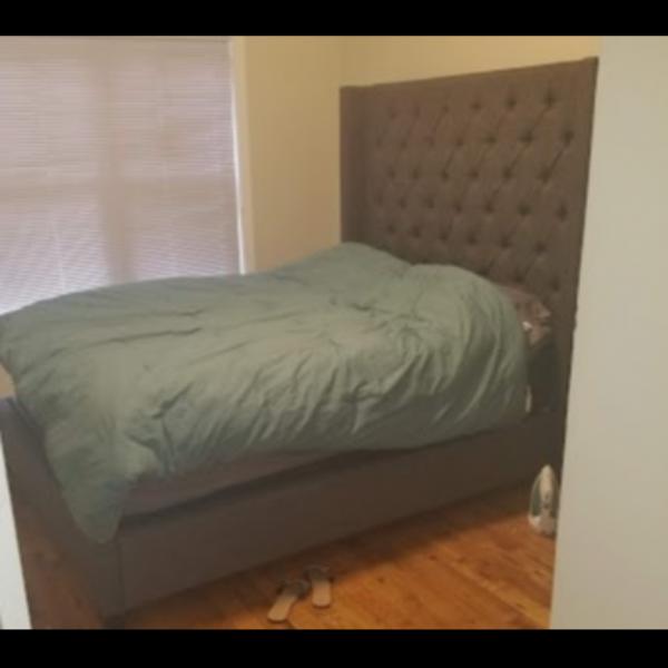 Photo of Gray Upholerested Bed Frame