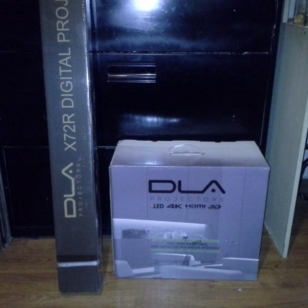 Photo of DLA Projector and 72 “ screen (new in box) $300 obo)